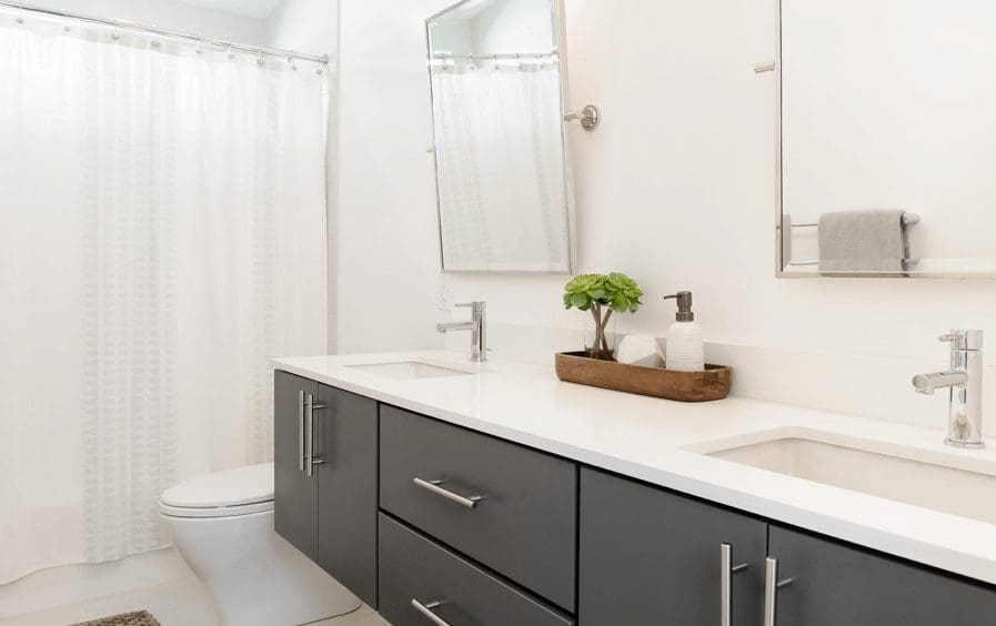 Bathroom with two mirrors and one vanity