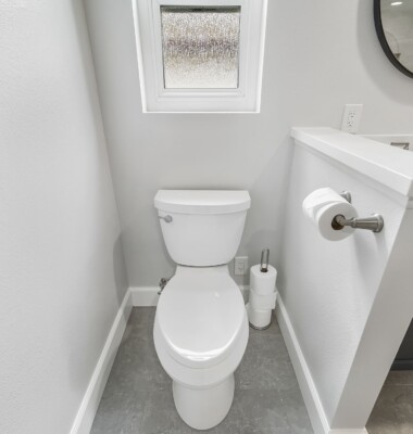 bathroom with attached toilet